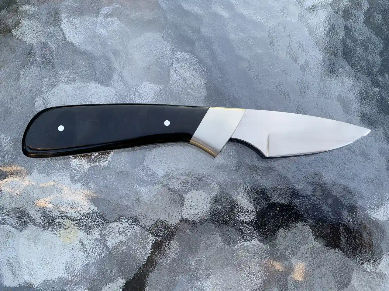 1084 carbon steel slim hunter with black micarta handles - rear view