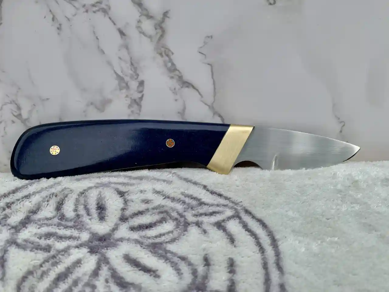Stainless steel slim skinner with canyon blue Richlite handles - rear view