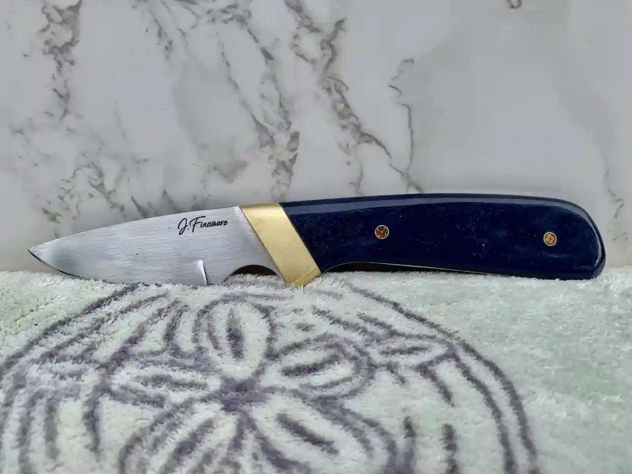 Stainless steel slim skinner with canyon blue Richlite handles - front view