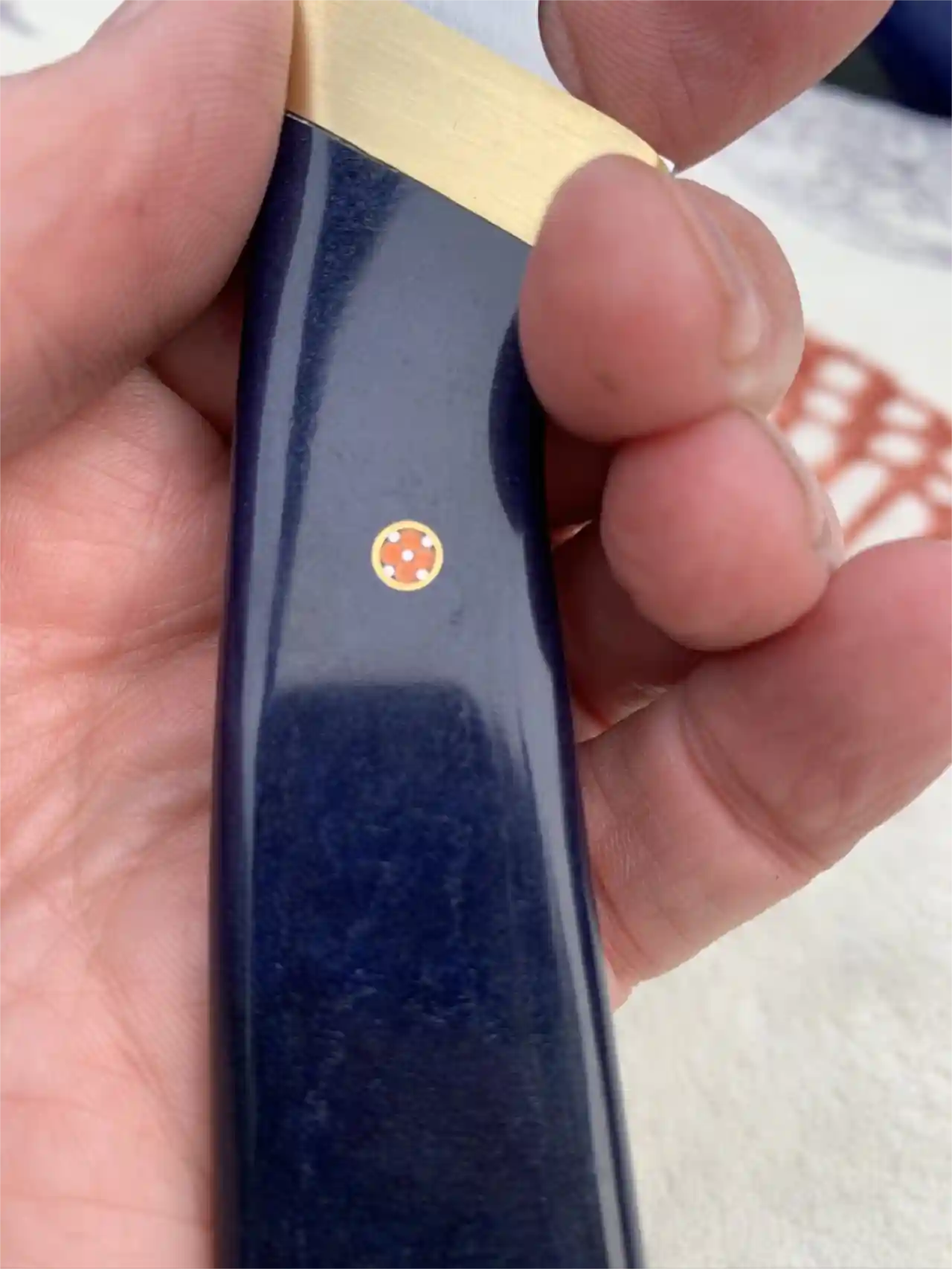 Stainless steel slim skinner with canyon blue Richlite handles - mosaic pin closeup