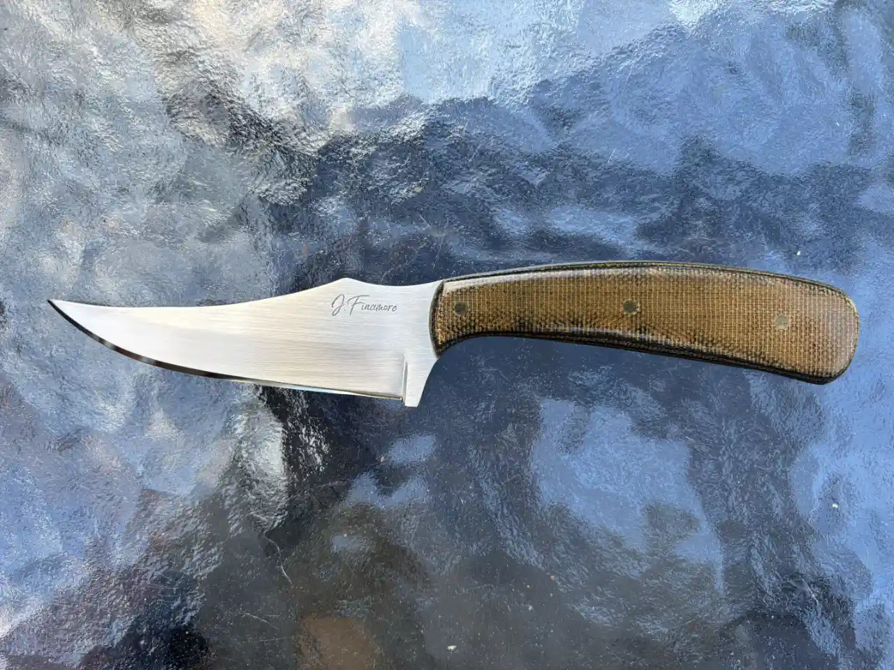 1084 carbon steel Sharpfinger with camo canvas micarta handles - front view
