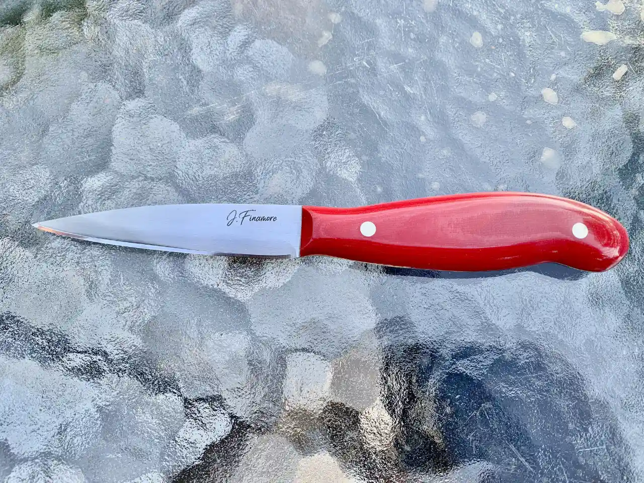 Kitchen paring knife with ruby red micarta handles - front view