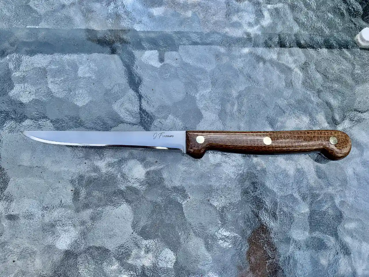 Stainless steel boning knife with burlap micarta handles - front view