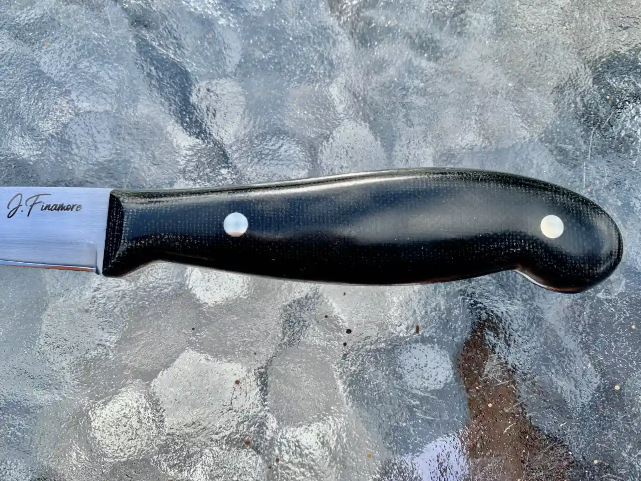 Kitchen paring knife with black micarta handles - closeup of handle front view
