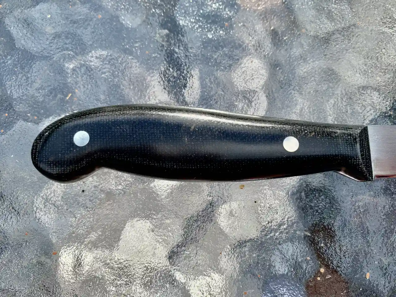 Kitchen paring knife with black micarta handles - closeup of handle rear view