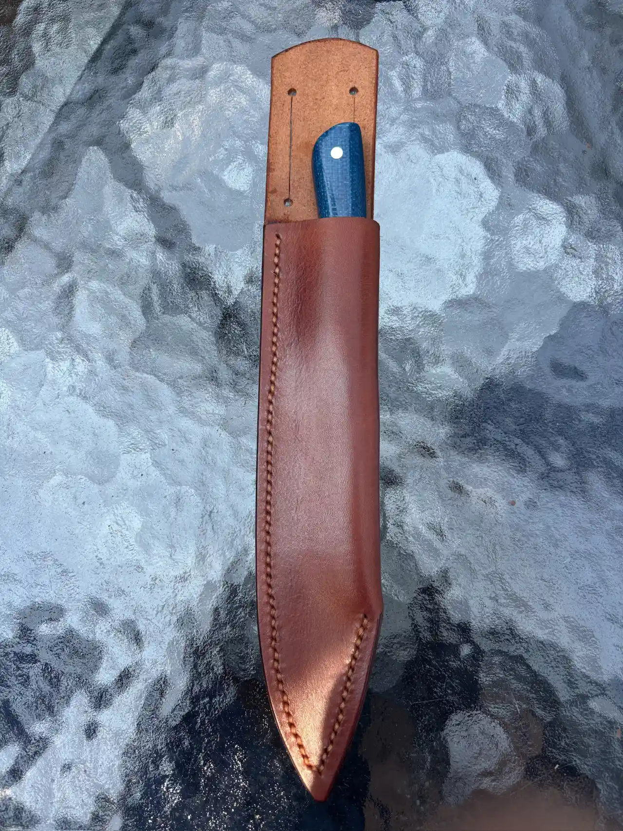 Bird and trout knife with admiral blue micarta handles in custom leather sheath