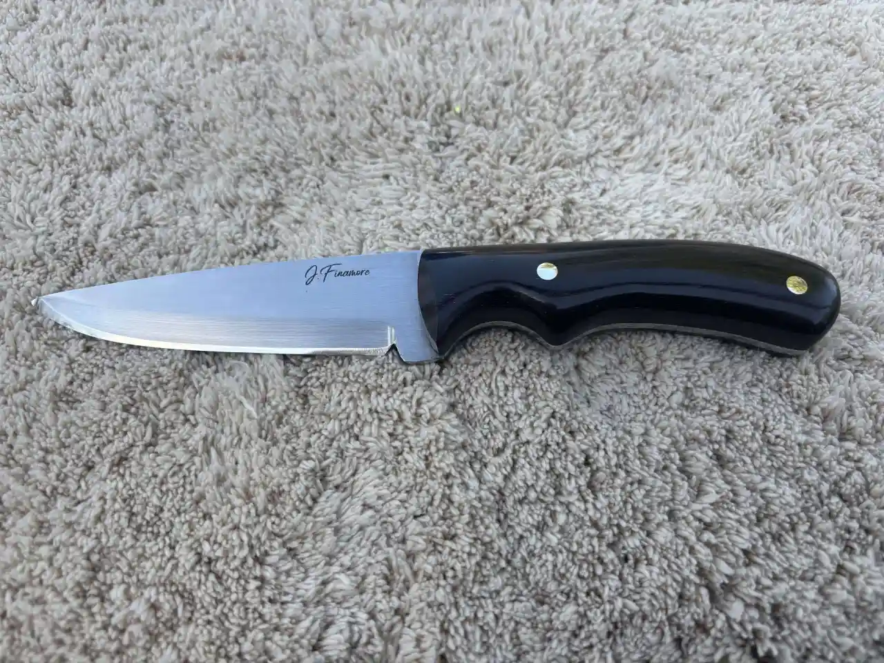 Bushcraft knife with natural ebony wood handles - front view