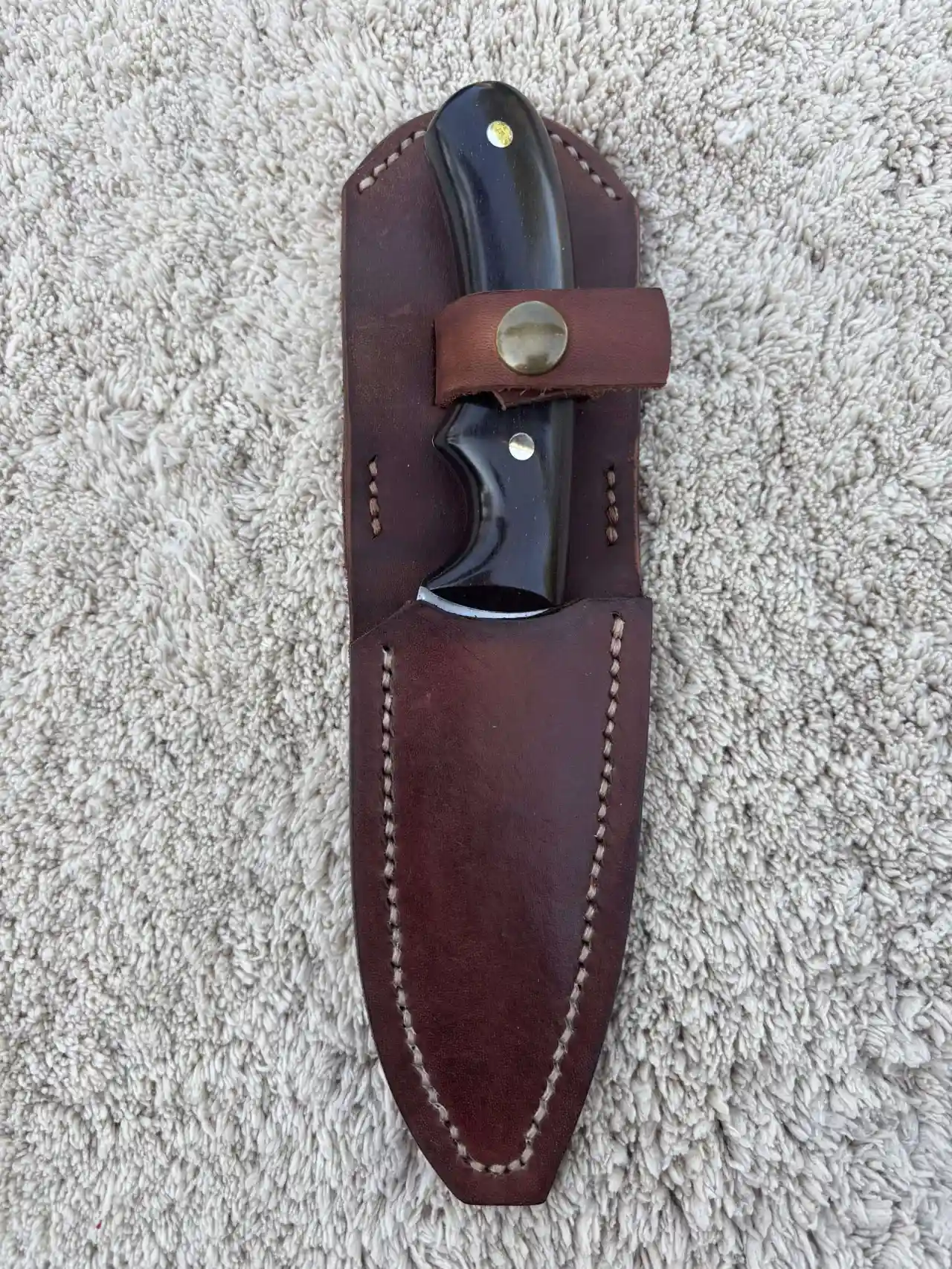 Bushcraft knife with natural ebony wood handles in a custom leather sheath