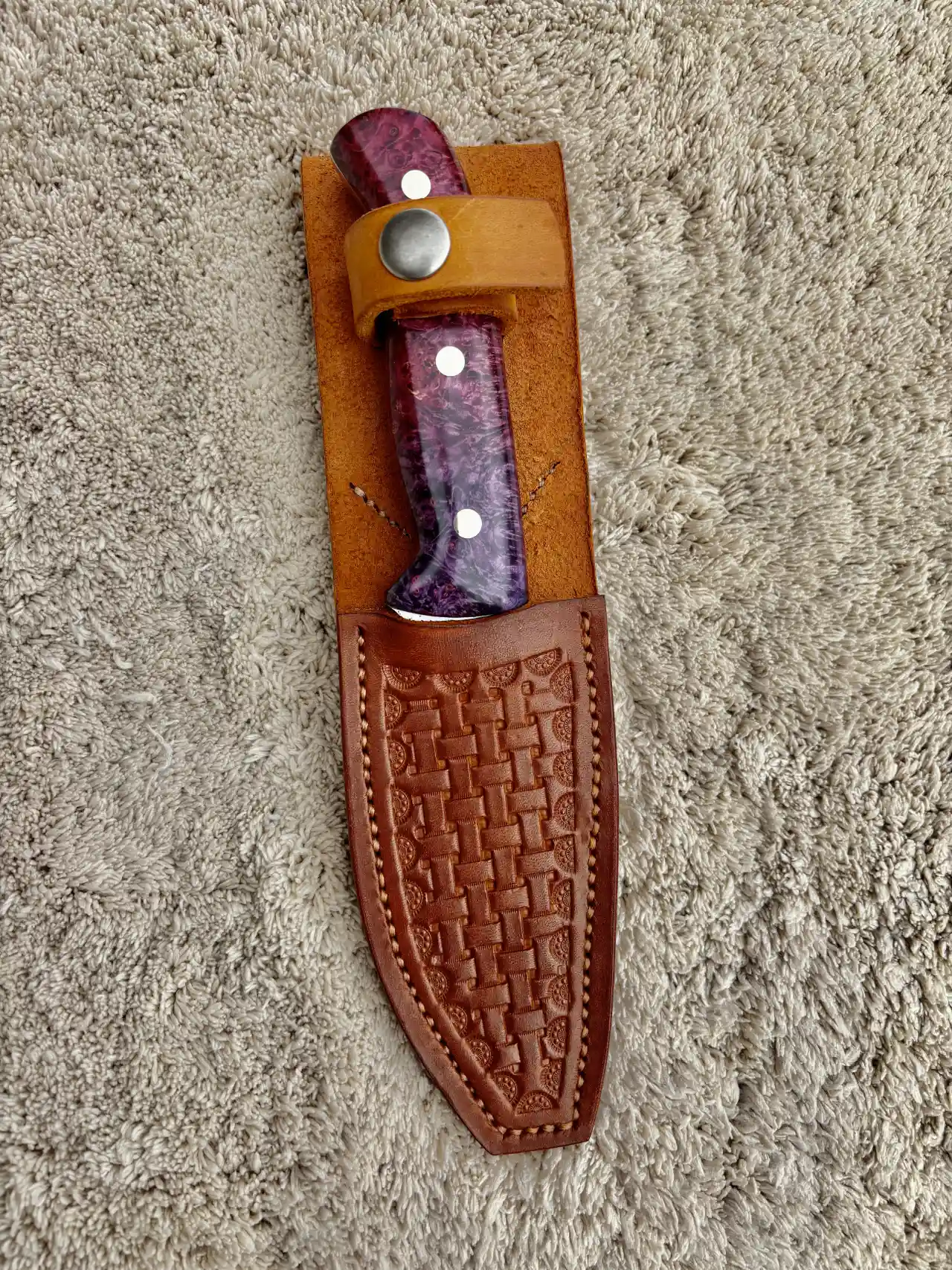 Bushcraft knife with dyed box elder wood handles in a custom, hand tooled, leather sheath
