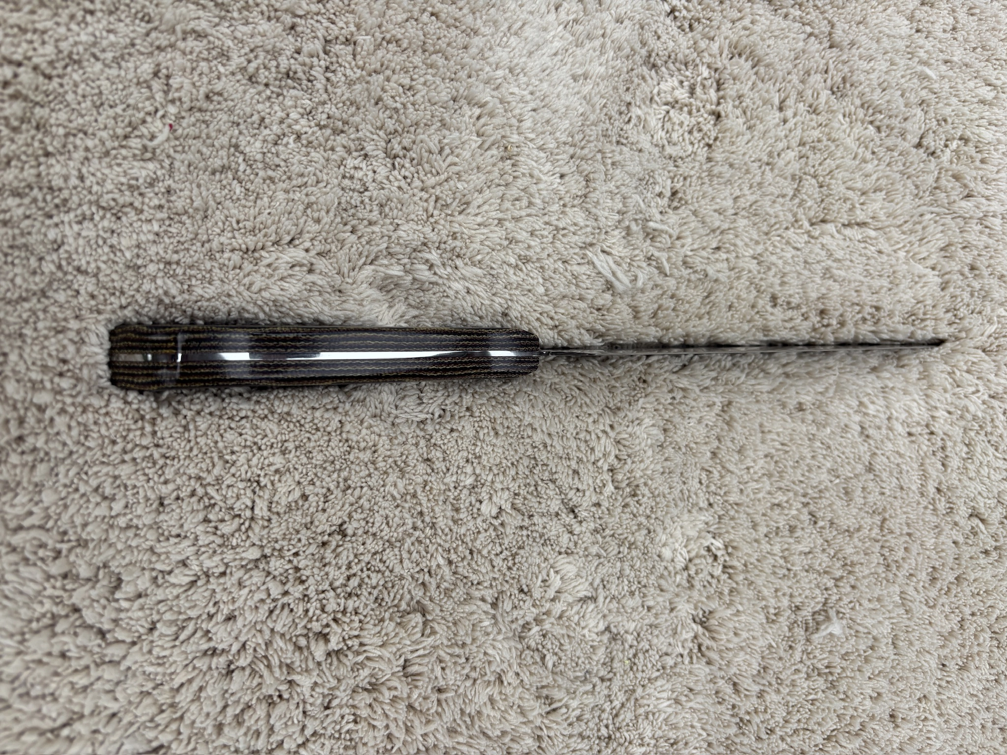 Chefs knife with pythom pattern micarta handles - Bottom spine view