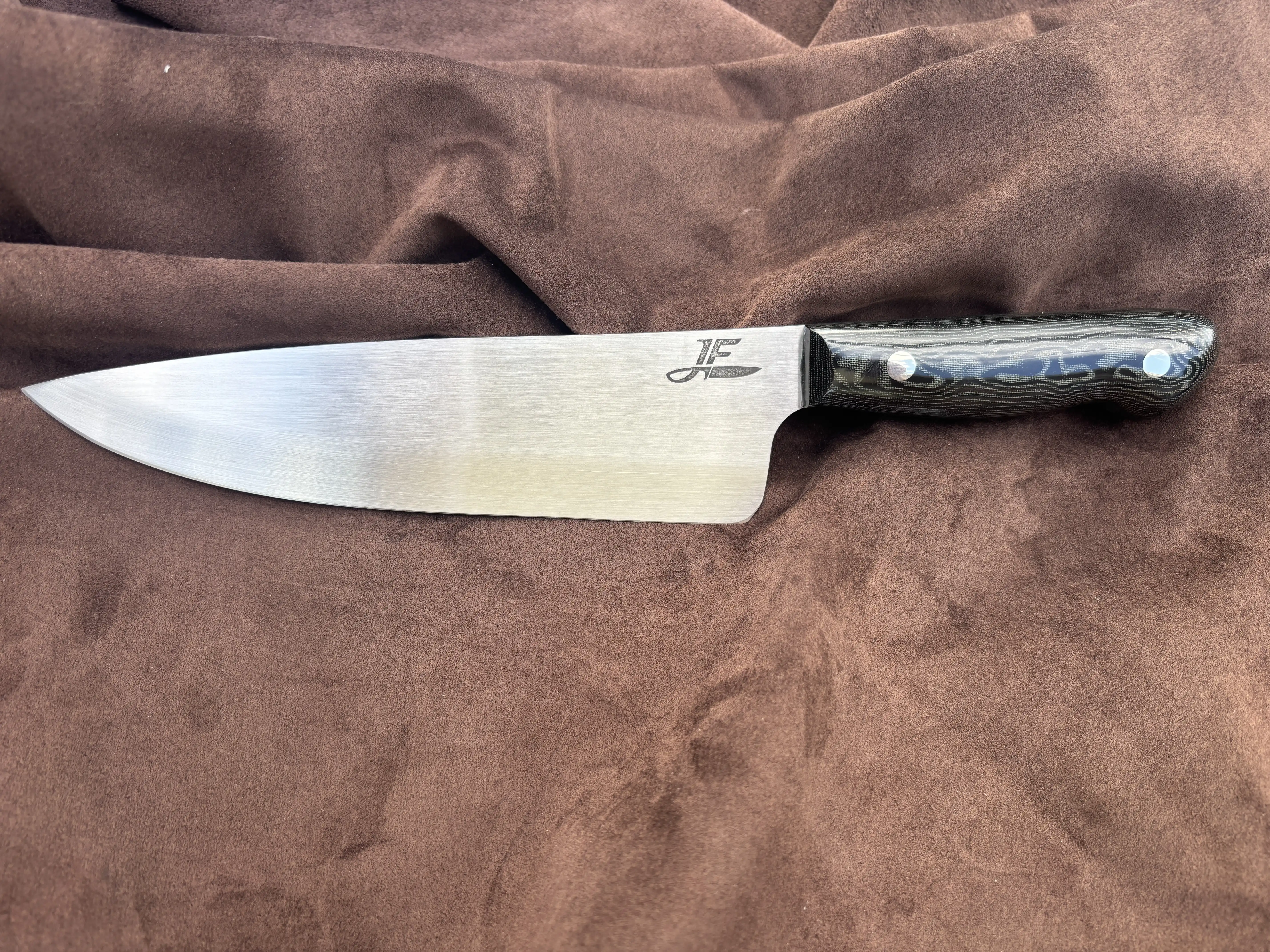 Chefs knife with black snakeskin micarta handles - Front view