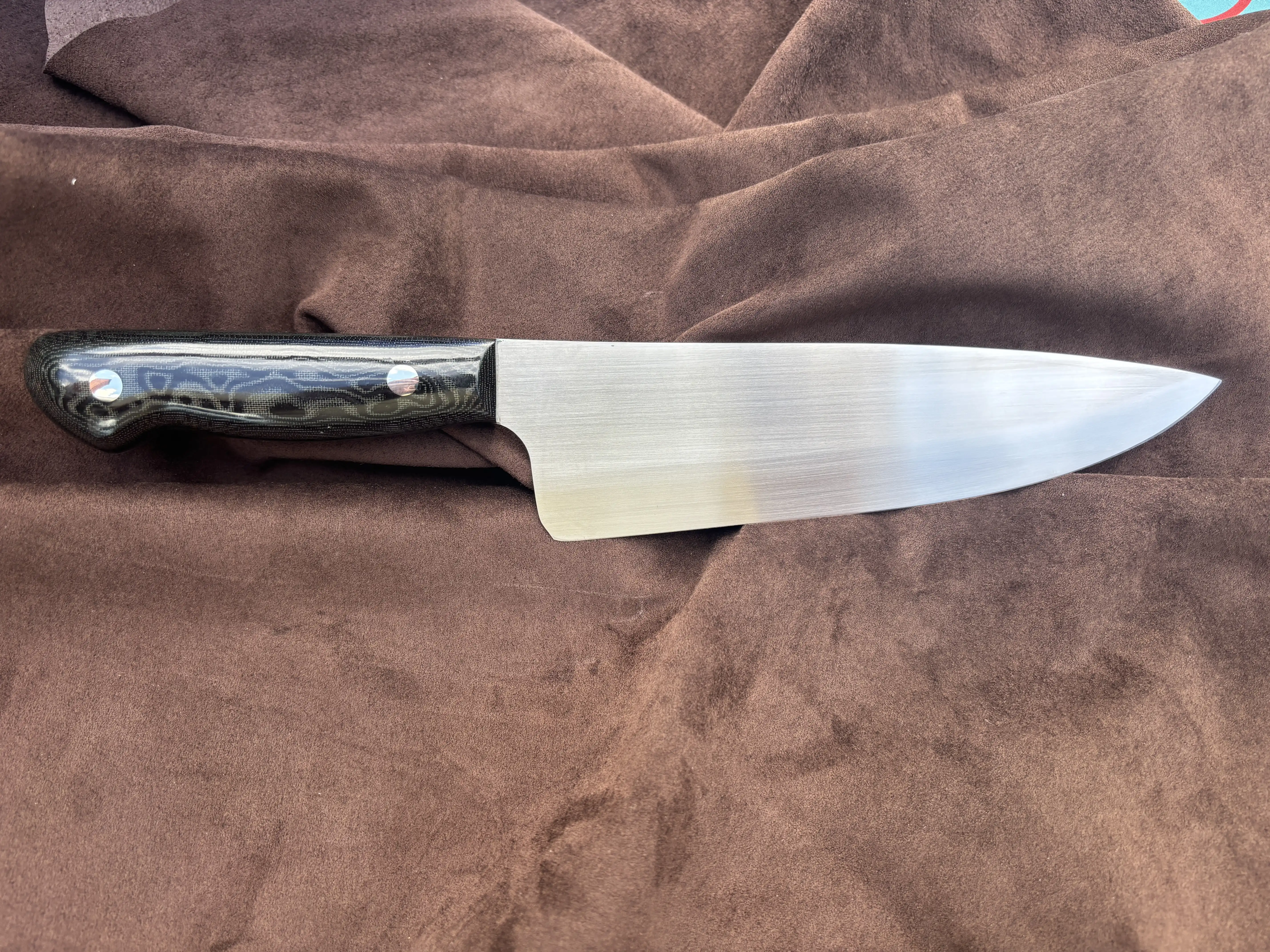 Chefs knife with black snakeskin micarta handles - Rear view