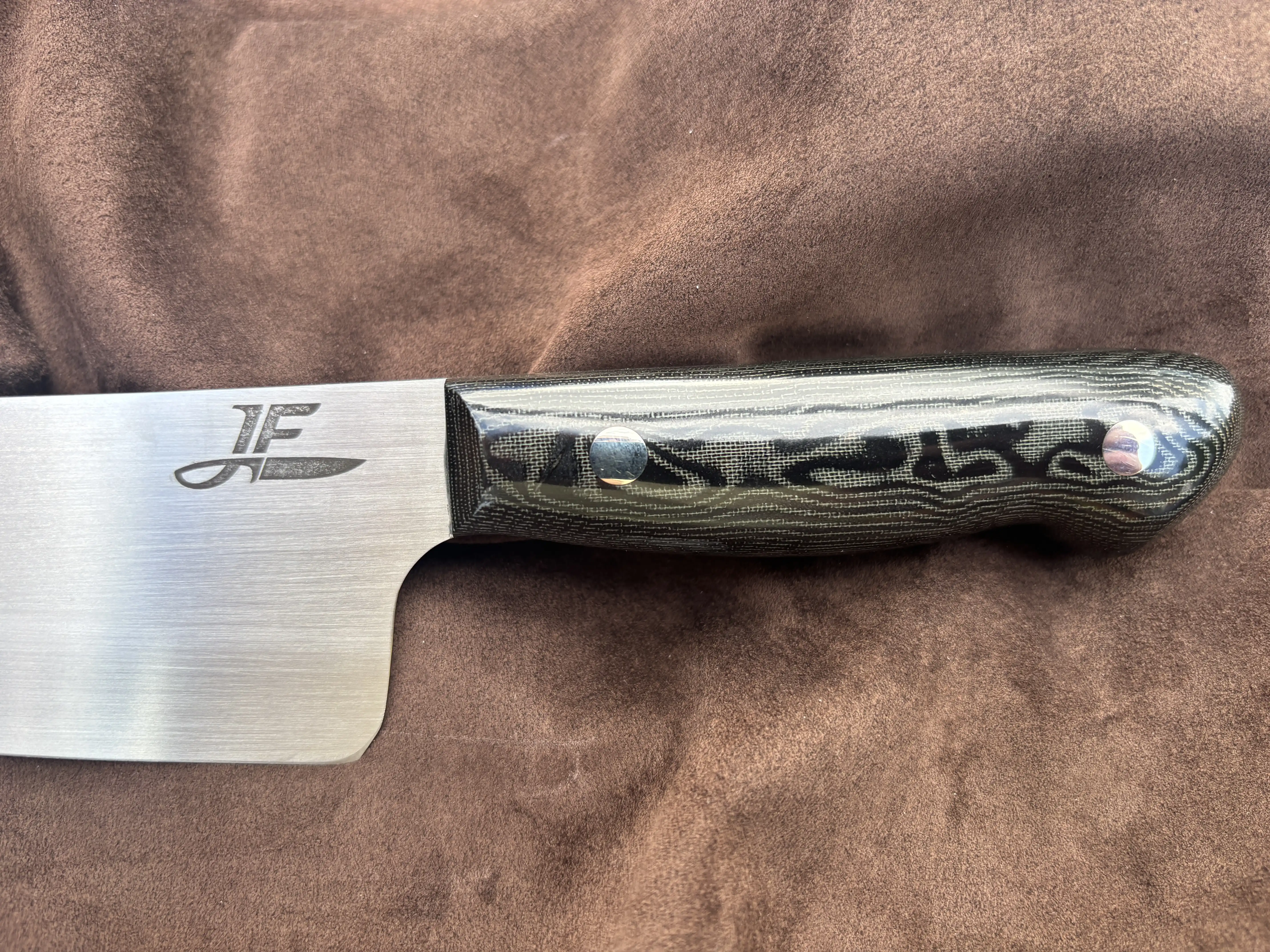 Chefs knife with black snakeskin micarta handles - Front handle view
