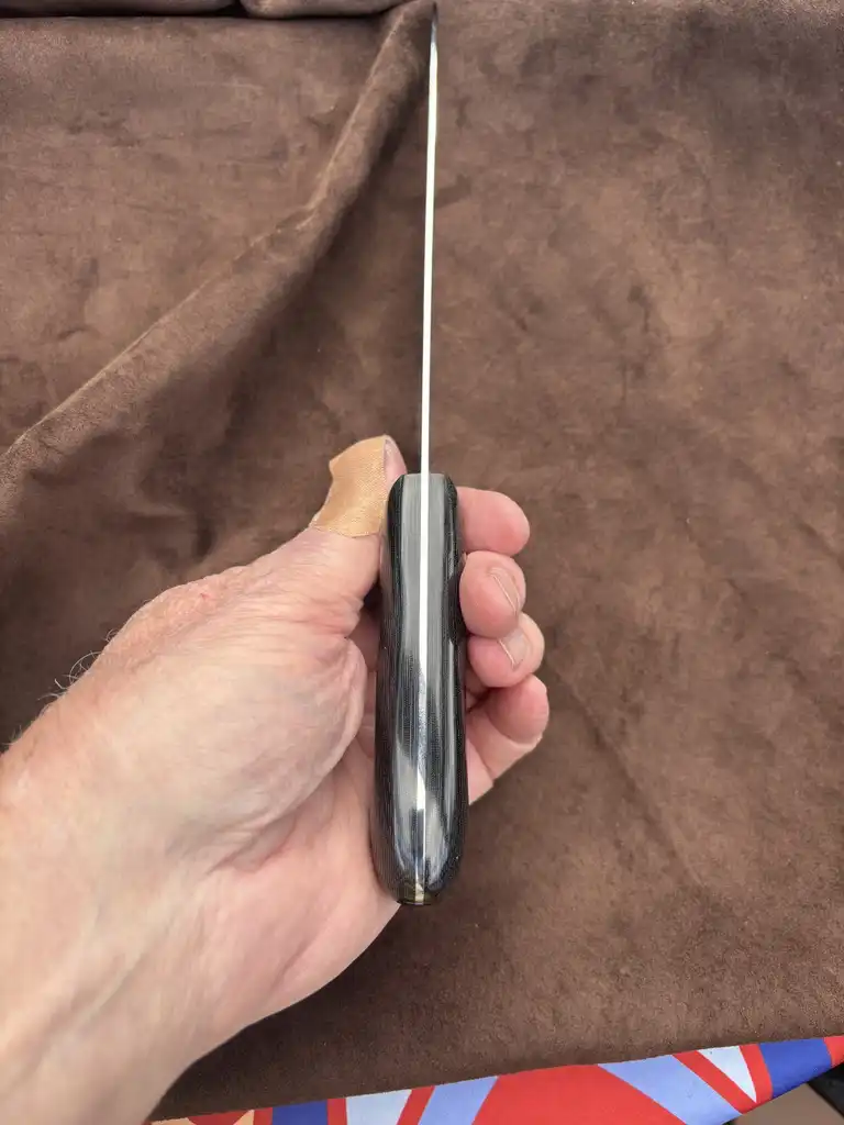 Chefs knife with black snakeskin micarta handles - Top spine view